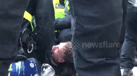 Anti-lockdown protestor tackled to the ground by police, gets bloody nose