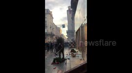 Protester smashes store window at French security law protest in Bordeaux