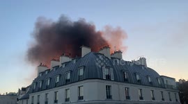 Fire at Paris security law protests
