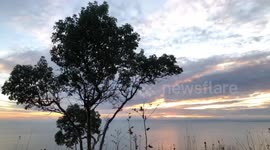 Watch as sunset is enveloped by thick fog over Seattle, Washington