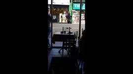 Man dancing in the middle off the road