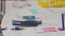 Car driving over manhole hits Chinese worker's head as he suddenly pops out