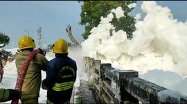 Firefighters in India battle to contain toxic foam overflowing from polluted river