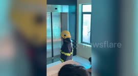 Firefighters rescue people stuck in lift in Vietnam