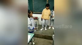 Chinese teacher suspended after forcing students to smash their phones in class
