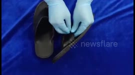 Southern India airport custom officials seize gold conceal in flip flop straps, Saudi Riyals and US  Dollars worth $ 25128 smuggled by two passengers