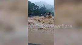 Swollen river rages after heavy rain in southern Thailand