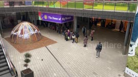 People queue outside shops in London after lockdown is lifted
