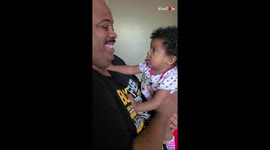 This baby girl is definitely not a fan of her dad's new shave
