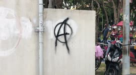 Protesters spray anti-monarchy graffiti in Thailand