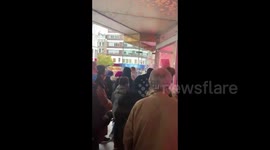 UK: Shoppers Line Up Outside Collapsing Debenhams Department Store In London