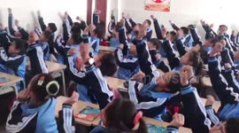 Primary school students perform traditional Mongolian dance in class