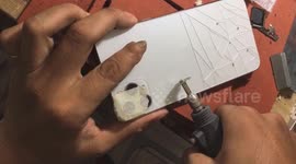 Vietnamese man uses grinder to create unique patterns on back of iPhone