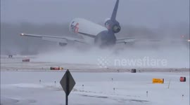 FedEx flight disappears into cloud of snow as it lands in New York
