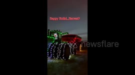 Snowman Hops On Beautifully Illuminated Harvesting Tractor