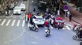 Pedestrians and motorists team up to free girl trapped underneath car in China