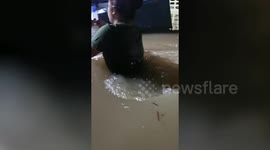 Southern Thailand floods: Citizens wade through waist-high water