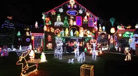 The brothers behind one of Britain's most festive Christmas spectaculars have covered their homes with 50,000 Christmas lights