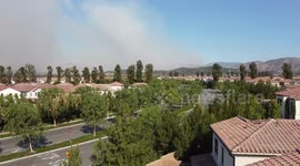 Wildfire in Irvine California shot with Drone Rising over homes