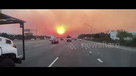 US: Fiery Sunrise Due To Smoke From Bond Fire In California