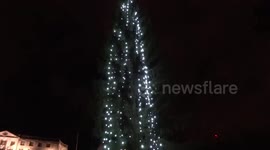 Small crowd gather as Trafalgar Square Christmas tree 2020 switched on