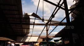 Storm rips roof from indoor food market in Thailand