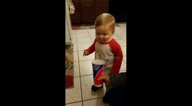 Moment toddler has first sip of root beer and is not impressed