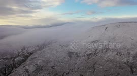 Cloud Inversion Over Mountain Snow - Drone Clip 8