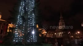 Trafalgar Square Christmas Tree 2020 lights are on with Norway anti-whalers rallying