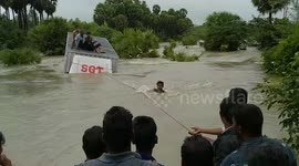 Dramatic rescue for Indian lorry passengers caught in raging flash floods