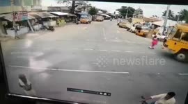 Miraculous moment elderly Indian woman escapes unscathed after truck runs her over