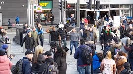Anti-lockdown protesters wipe their BUTTS with face masks while dancing in Stratford, London