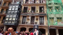 Balcony Throws Water on Pamplona Spain During Running of the Bulls