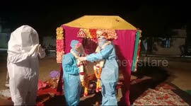 Indian couple marry in PPE after bride tests positive for COVID on her wedding day