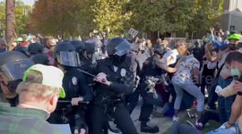 LAPD clash with protesters outside mayor's residence