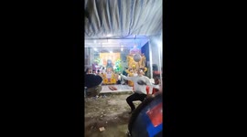 Skilful Vietnamese man balances spinning football on knife held in his mouth