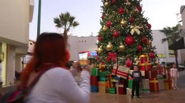 Children and adults take photos of the new Christmas tree in the center of Hermosillo, Mexico.
