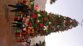 Children and adults take photos of the new Christmas tree in the center of Hermosillo, Mexico. Christmas lights