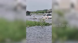 Pickup truck driver powers through flooded road, knocks over elderly man in Thailand