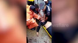 Drowning Man Rescued From Floods In Southern Thailand