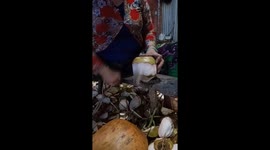 Have you ever seen coconuts peeled this fast? Vietnamese workers operate at lightning speed