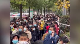 Crowds queue for COVID-19 testing after case emerges in southern China