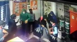 Shocking CCTV footage catches three masked robbers holding up petrol pump at gunpoint