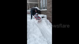 Baby has sledging mishap in backyard during his first snow experience in Canada