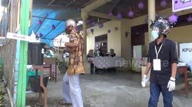 COVID-19 decorations adorn polling station in Indonesia's West Sumatra