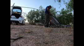 time lapse of a couple's camping or tent setup in a country field in Hermosillo, Sonora, Mexico
