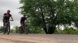 cyclists on the highway on a cloudy day in the magical town of Alamos, Sonora, Mexico.