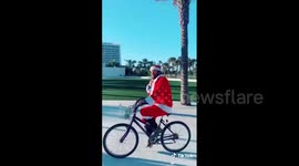 Florida man dressed as Santa Claus cruises on his bike in Fort Lauderdale