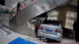 Car smashes into hospital injuring two after motorist presses accelerator by mistake in southern China