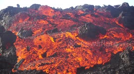 Molten lava streams down erupting volcano on Réunion island
